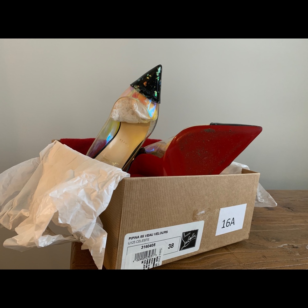 C. Louboutin- Confetti translucent-sold as is.